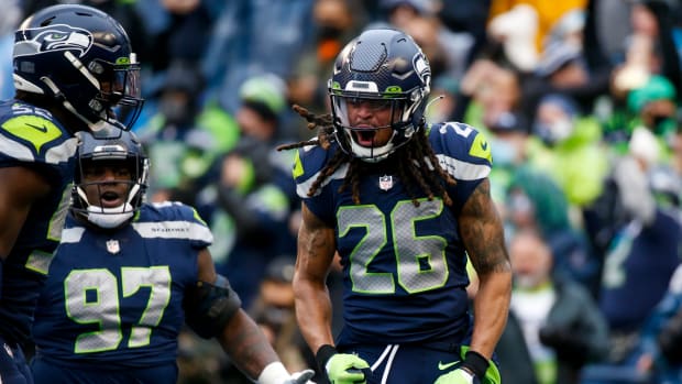 Seattle Seahawks defensive back Ryan Neal (26) celebrates following a play against the Detroit Lions during the second quarter at Lumen Field.